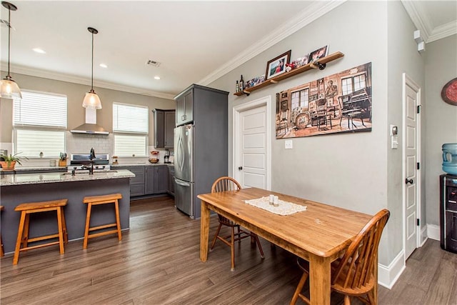 5 Leeward Ct, New Orleans, LA 70131 - dining area with ornamental molding, dark wood-type flooring, and recessed lighting