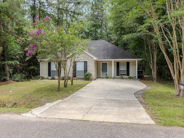 653 Beaulieux St, Mandeville, LA 70448 - single story home with a front lawn and driveway