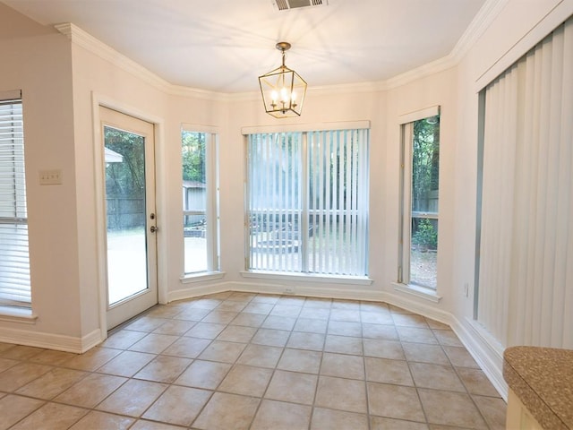 653 Beaulieux St, Mandeville, LA 70448 - unfurnished dining area with light tile patterned flooring, a chandelier, baseboards, and crown molding