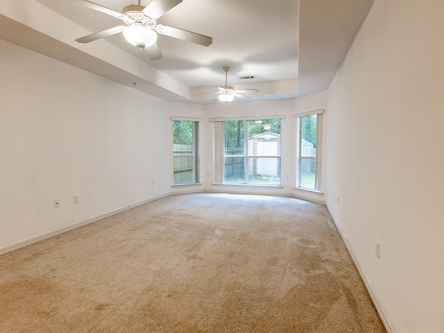 653 Beaulieux St, Mandeville, LA 70448 - carpeted empty room featuring a raised ceiling, ceiling fan, and baseboards