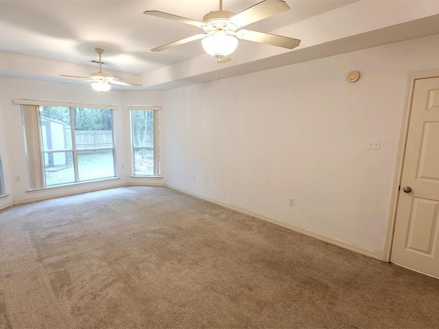 653 Beaulieux St, Mandeville, LA 70448 - carpeted spare room with ceiling fan, a smoke detector, baseboards, and a tray ceiling
