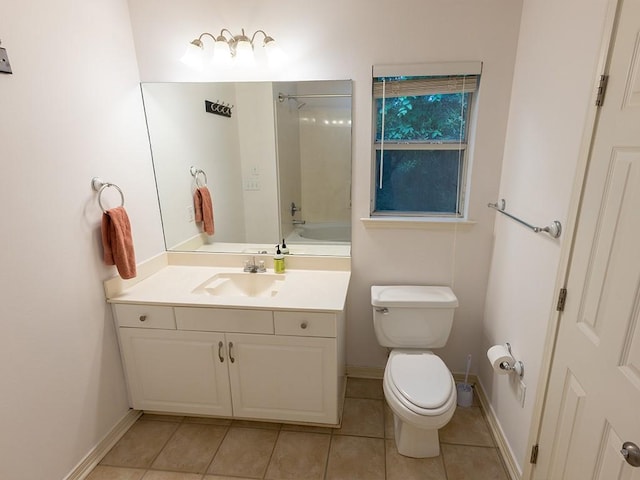 653 Beaulieux St, Mandeville, LA 70448 - bathroom featuring toilet, vanity, tile patterned floors, baseboards, and shower / tub combination