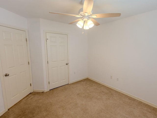 653 Beaulieux St, Mandeville, LA 70448 - empty room with light colored carpet, ceiling fan, and baseboards