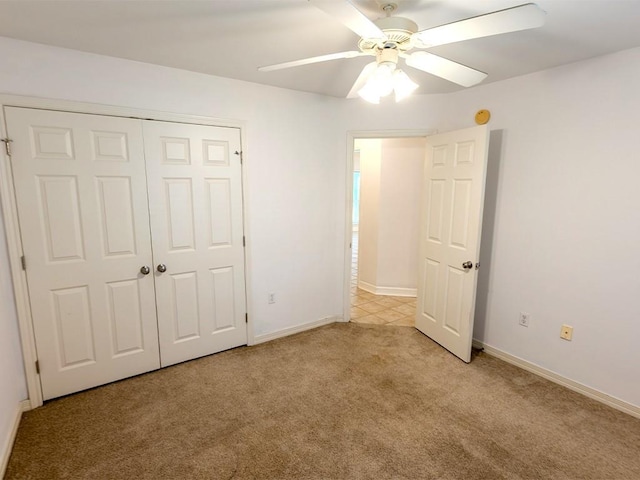 653 Beaulieux St, Mandeville, LA 70448 - unfurnished bedroom featuring carpet floors, baseboards, a closet, and ceiling fan