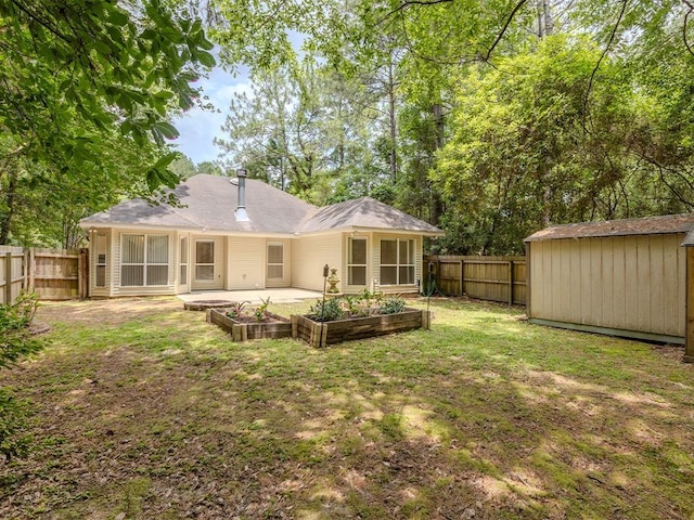 653 Beaulieux St, Mandeville, LA 70448 - back of property featuring a garden and a patio area