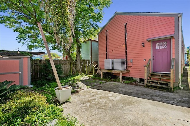 222527 Iberville St, New Orleans, LA 70119 - rear view of property with entry steps, a patio area, and central AC unit