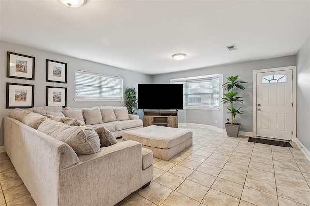 4616 Kawanee Ave, Metairie, LA 70006 - living area with light tile patterned floors and baseboards