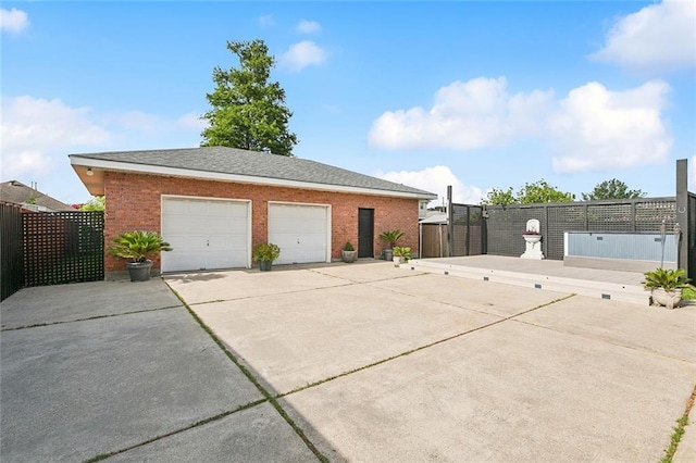 4616 Kawanee Ave, Metairie, LA 70006 - view of property exterior featuring brick siding, a detached garage, and a gate