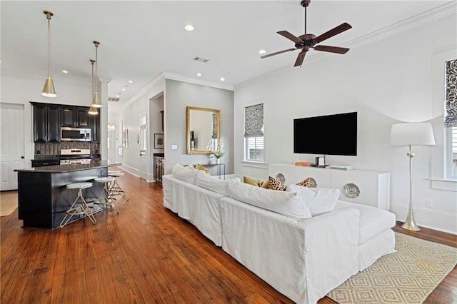 1215 Saint Andrew St, New Orleans, LA 70130 - living room with dark wood-style flooring, healthy amount of natural light, a ceiling fan, recessed lighting, and baseboards