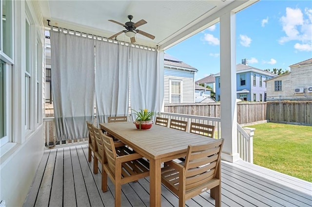 1215 Saint Andrew St, New Orleans, LA 70130 - sunroom featuring ceiling fan, outdoor dining space, and a residential view