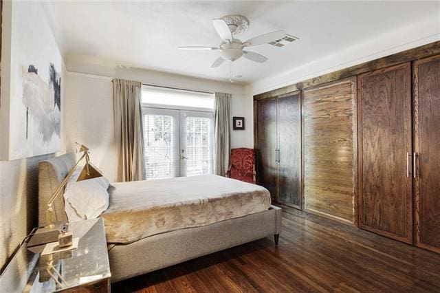 1510 Camp St, New Orleans, LA 70130 - bedroom featuring french doors, dark wood-style floors, and ceiling fan