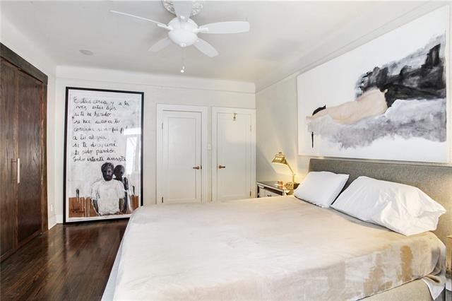 1510 Camp St, New Orleans, LA 70130 - bedroom with wood finished floors and a ceiling fan