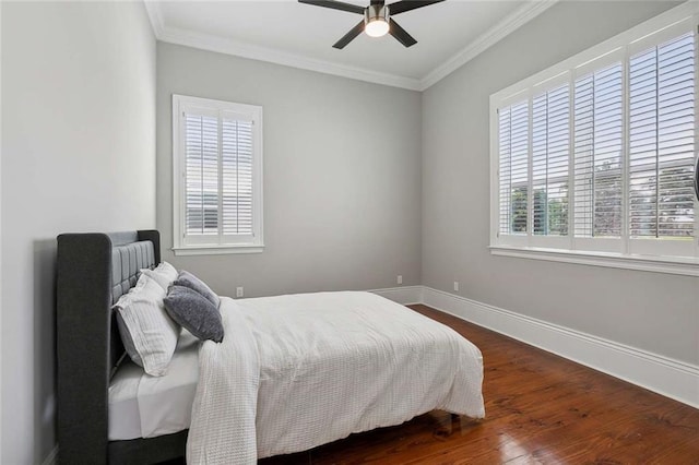 4823 Dreux Ave, New Orleans, LA 70126 - bedroom featuring dark wood finished floors, ornamental molding, baseboards, and ceiling fan