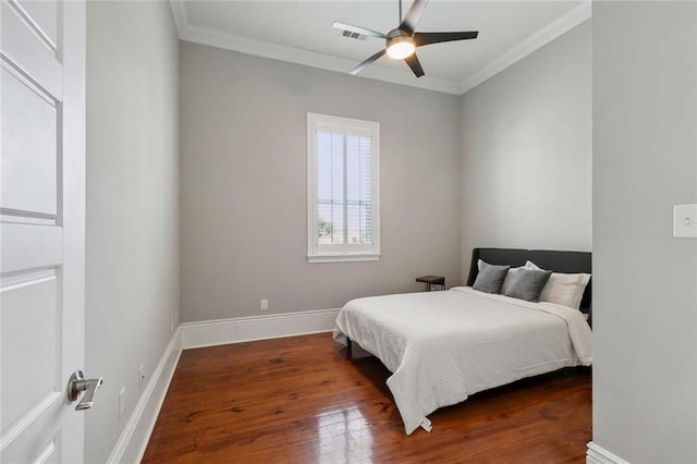 4823 Dreux Ave, New Orleans, LA 70126 - bedroom with ornamental molding, wood finished floors, baseboards, and a ceiling fan