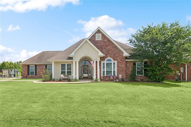 1115 Primrose Dr, Boutte, LA 70039 - view of front of home featuring a front yard, brick siding, and roof with shingles