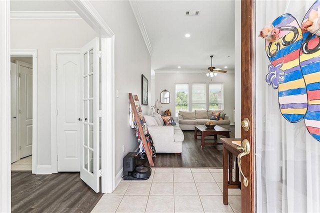 1115 Primrose Dr, Boutte, LA 70039 - foyer with ornamental molding, wood finished floors, ceiling fan, recessed lighting, and baseboards