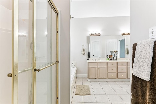 1115 Primrose Dr, Boutte, LA 70039 - bathroom featuring tile patterned floors, vanity, a stall shower, a garden tub, and baseboards