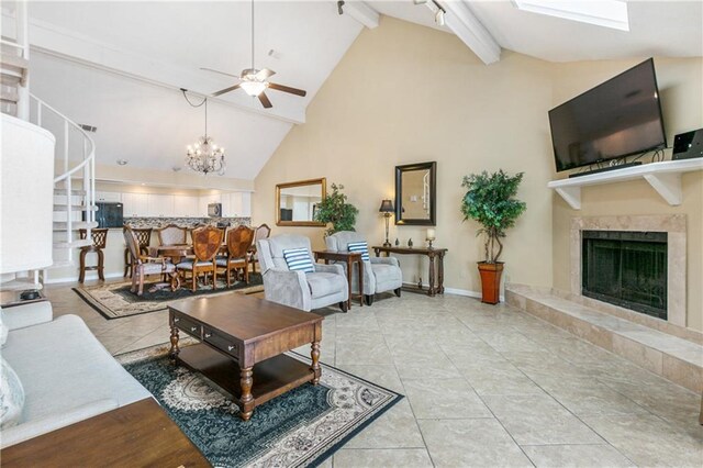 1163 Marina Dr Unit 1163, Slidell, LA 70458 - living area featuring a premium fireplace, ceiling fan, beamed ceiling, high vaulted ceiling, and a chandelier