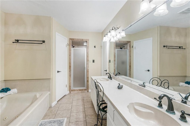1163 Marina Dr Unit 1163, Slidell, LA 70458 - full bathroom with a stall shower, double vanity, a jetted tub, tile patterned flooring, and baseboards