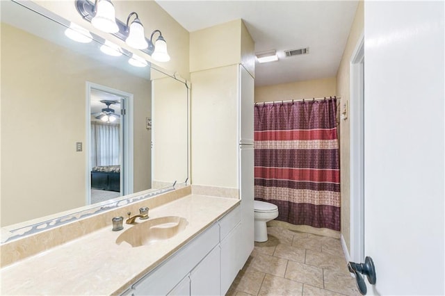 1163 Marina Dr Unit 1163, Slidell, LA 70458 - bathroom with toilet, vanity, tile patterned floors, and curtained shower