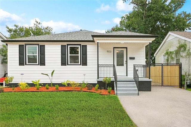 903 N Turnbull Dr, Metairie, LA 70001 - view of front of house with a porch, a front yard, and roof with shingles