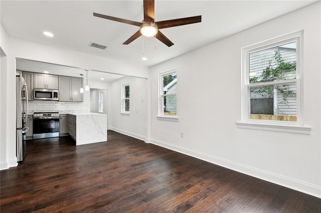 903 N Turnbull Dr, Metairie, LA 70001 - unfurnished living room with dark wood finished floors, a ceiling fan, and recessed lighting