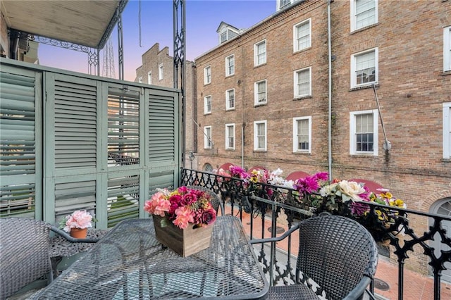 515 Saint Louis St Unit 6, New Orleans, LA 70130 - view of balcony at dusk
