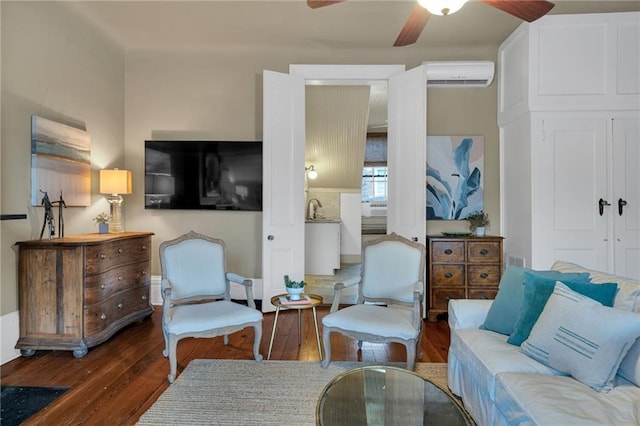 515 Saint Louis St Unit 6, New Orleans, LA 70130 - living room featuring a wall unit AC, wood finished floors, and a ceiling fan