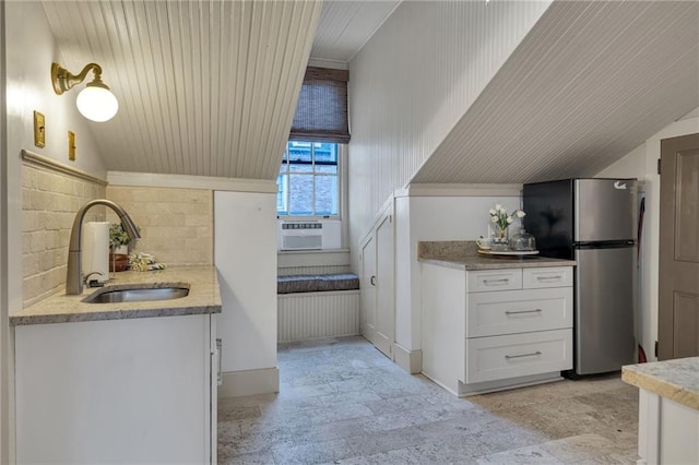 515 Saint Louis St Unit 6, New Orleans, LA 70130 - bathroom featuring vanity, backsplash, lofted ceiling, cooling unit, and stone finish flooring