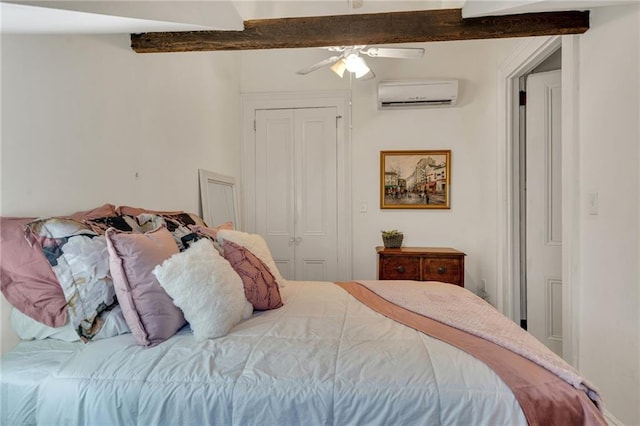 515 Saint Louis St Unit 6, New Orleans, LA 70130 - bedroom with an AC wall unit, a closet, ceiling fan, and beamed ceiling