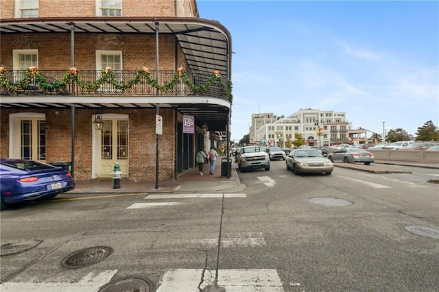 515 Saint Louis St Unit 6, New Orleans, LA 70130 - view of building exterior with uncovered parking