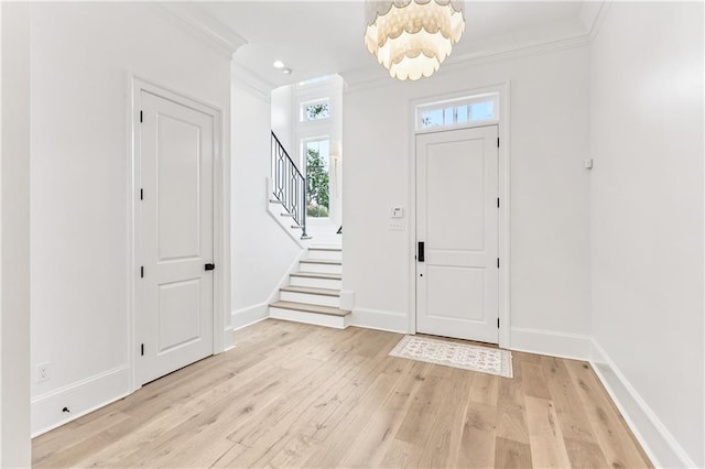 1617 Homer St, Metairie, LA 70005 - entrance foyer featuring crown molding, light wood-style flooring, stairway, and baseboards