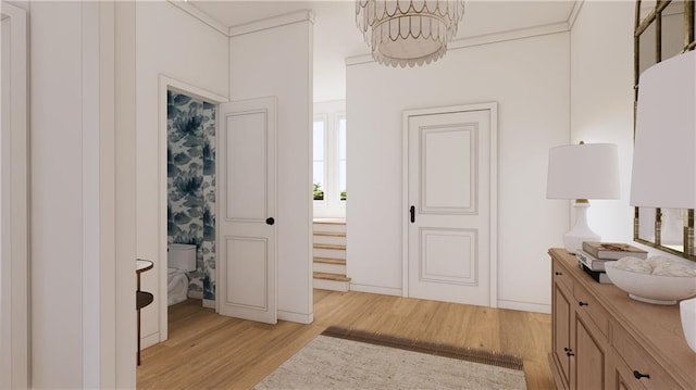 1617 Homer St, Metairie, LA 70005 - corridor featuring light wood-type flooring, a chandelier, and crown molding