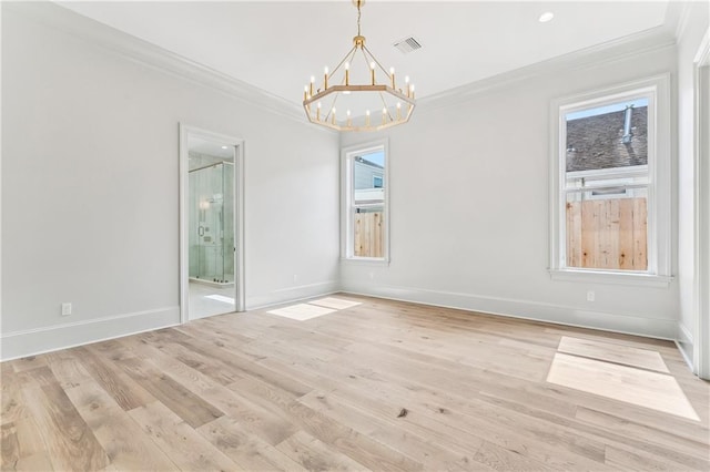 1617 Homer St, Metairie, LA 70005 - empty room featuring a chandelier, crown molding, plenty of natural light, baseboards, and light wood finished floors