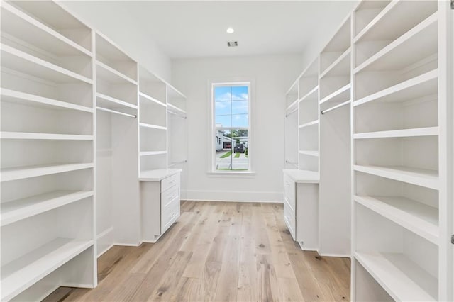 1617 Homer St, Metairie, LA 70005 - walk in closet with light wood-type flooring