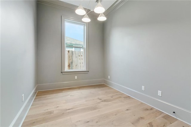 1617 Homer St, Metairie, LA 70005 - empty room featuring a chandelier, light wood-type flooring, baseboards, and ornamental molding