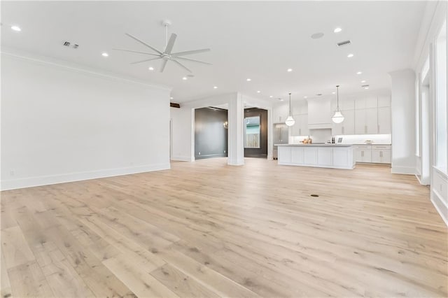 1617 Homer St, Metairie, LA 70005 - unfurnished living room with ornamental molding, a ceiling fan, light wood-style floors, baseboards, and recessed lighting