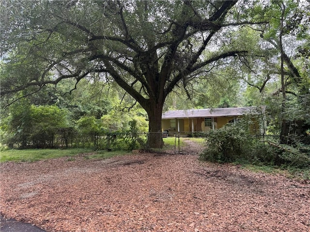27060 Pichon Rd, Lacombe, LA 70445 - fenced yard featuring a wooded view