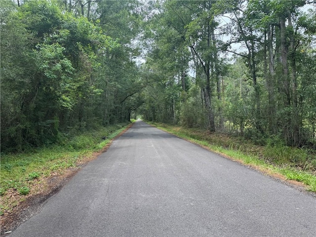 27060 Pichon Rd, Lacombe, LA 70445 - view of asphalt road featuring a view of trees