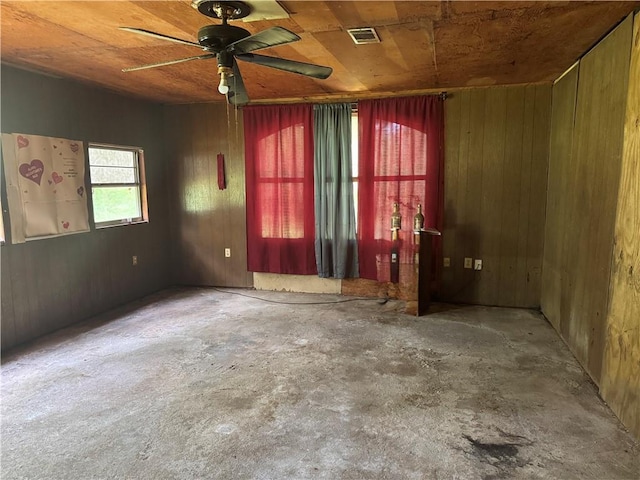 27060 Pichon Rd, Lacombe, LA 70445 - empty room featuring unfinished concrete flooring, ceiling fan, wood walls, and wood ceiling