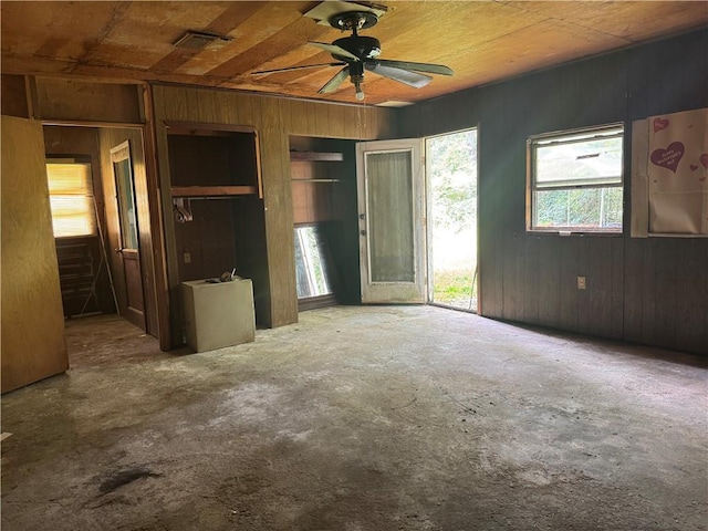 27060 Pichon Rd, Lacombe, LA 70445 - unfurnished bedroom featuring wood walls and ceiling fan