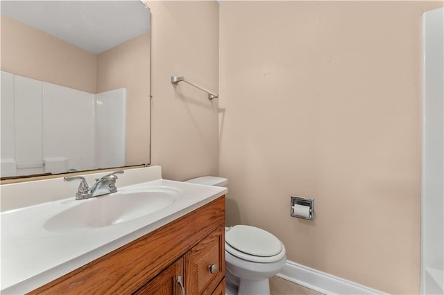 9101-9103 Atreus St, Chalmette, LA 70043 - bathroom with toilet, vanity, baseboards, and a shower