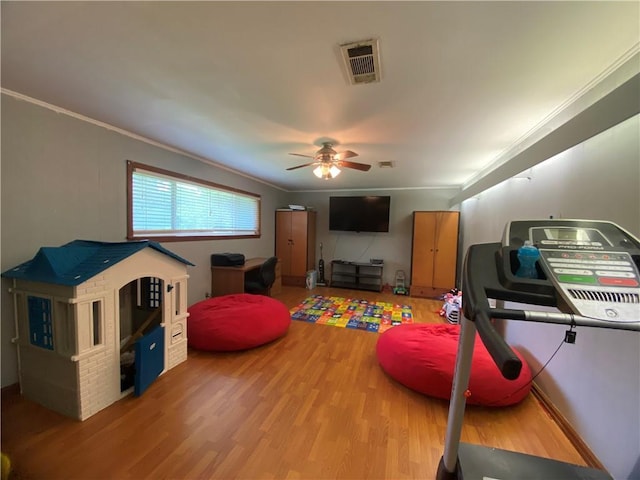 10116 16th Hwy, Amite, LA 70422 - exercise area featuring wood finished floors, a ceiling fan, and crown molding