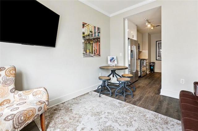 1111 Tulane Ave Unit 704, New Orleans, LA 70112 - sitting room featuring baseboards, crown molding, and wood finished floors