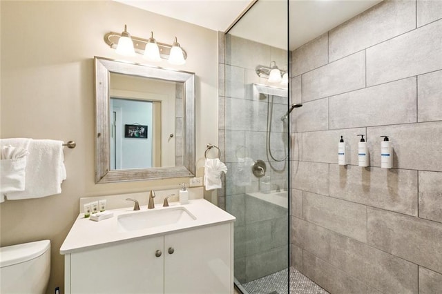 1111 Tulane Ave Unit 704, New Orleans, LA 70112 - full bathroom with vanity, toilet, and a tile shower