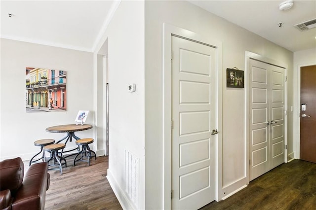 1111 Tulane Ave Unit 704, New Orleans, LA 70112 - hall featuring dark wood-type flooring, baseboards, and crown molding
