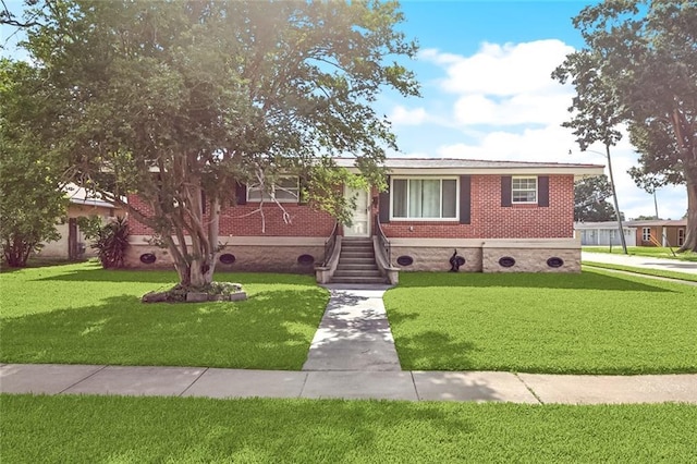 2320 Roosevelt Blvd, Kenner, LA 70062 - ranch-style house featuring a front yard and brick siding
