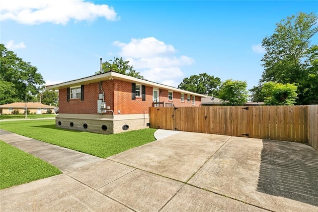 2320 Roosevelt Blvd, Kenner, LA 70062 - view of home's exterior featuring brick siding, a gate, and crawl space