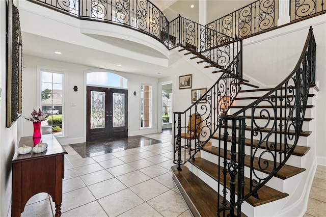 5 Asterbrook Ct, Harvey, LA 70058 - tiled foyer featuring french doors, a towering ceiling, baseboards, recessed lighting, and stairs