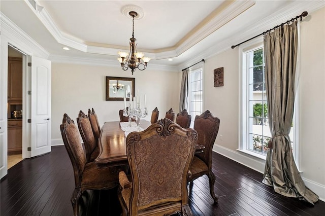 5 Asterbrook Ct, Harvey, LA 70058 - dining room featuring a chandelier, baseboards, dark wood-style flooring, a tray ceiling, and crown molding